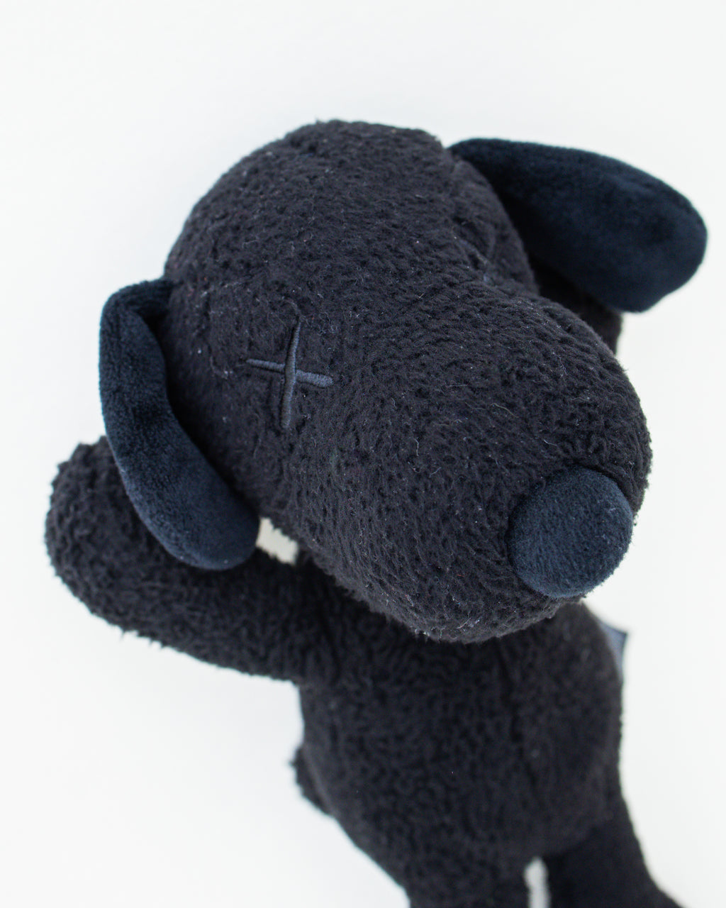 Peanuts x KAWS Black Snoopy Plush