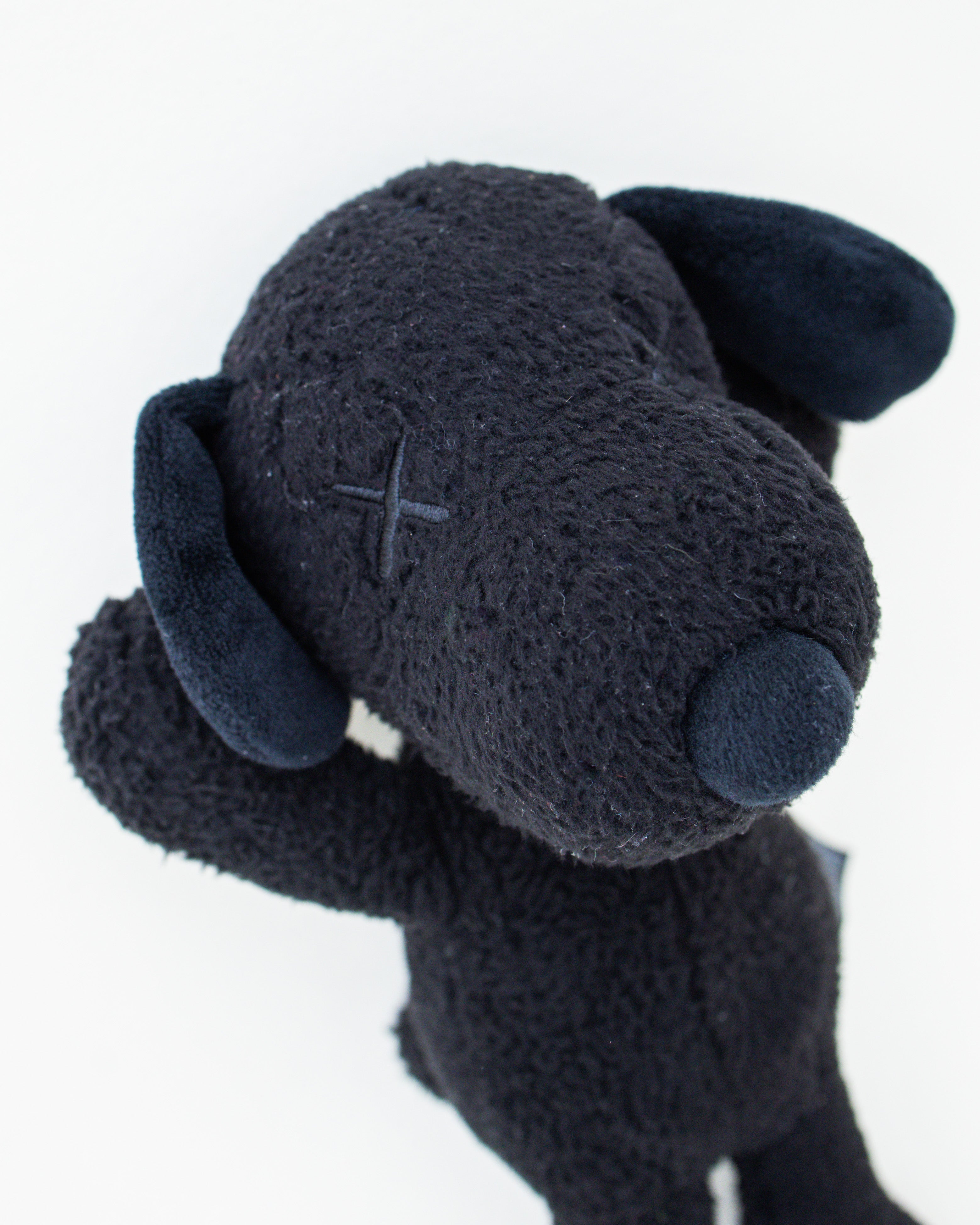 Peanuts x KAWS Black Snoopy Plush