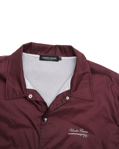 UNDERCOVERISM 'U' LOGO BURGUNDY COACHES JACKET